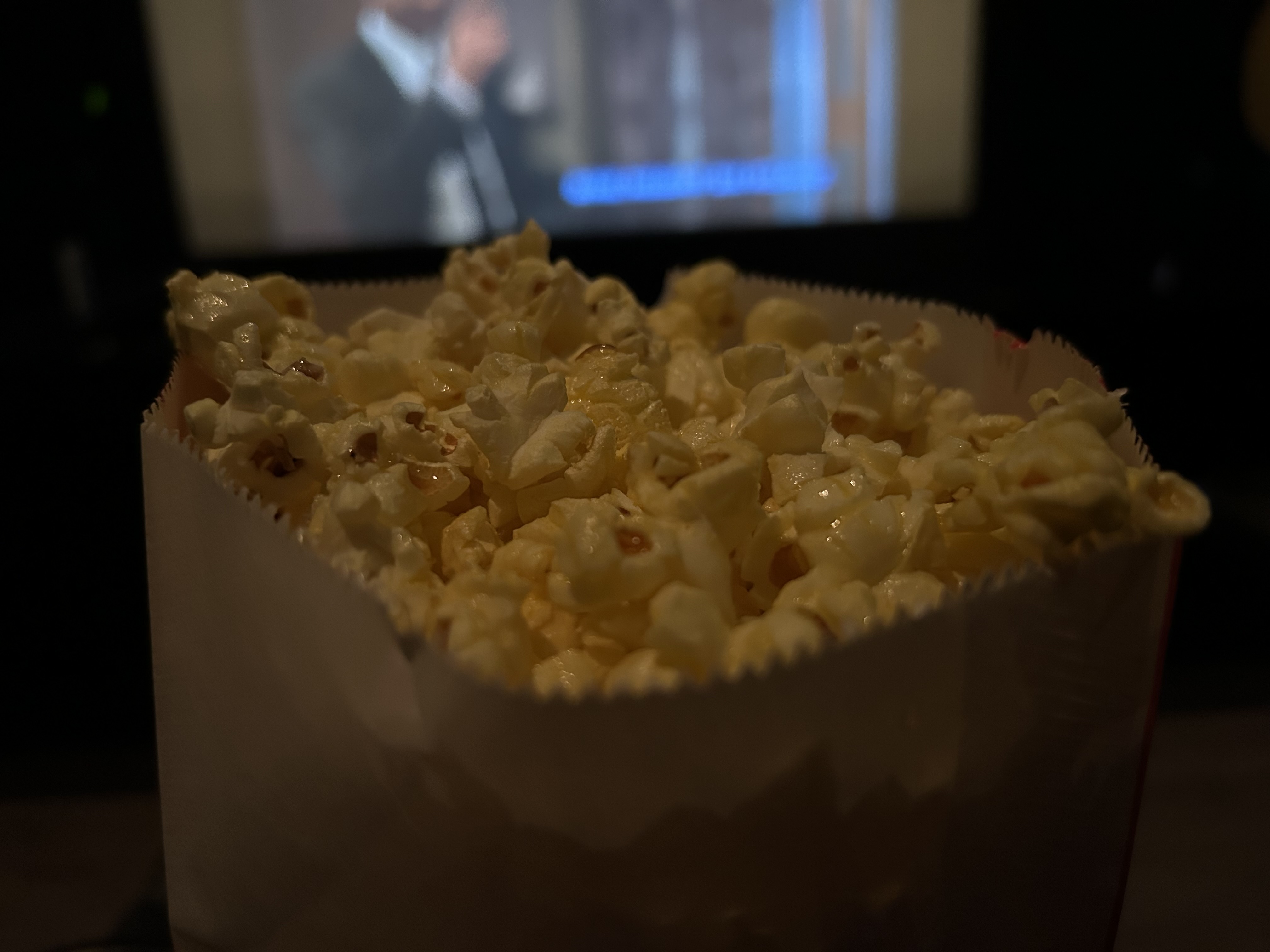 A photo of popcorn in a movie theater, taken with the iPhone 14.