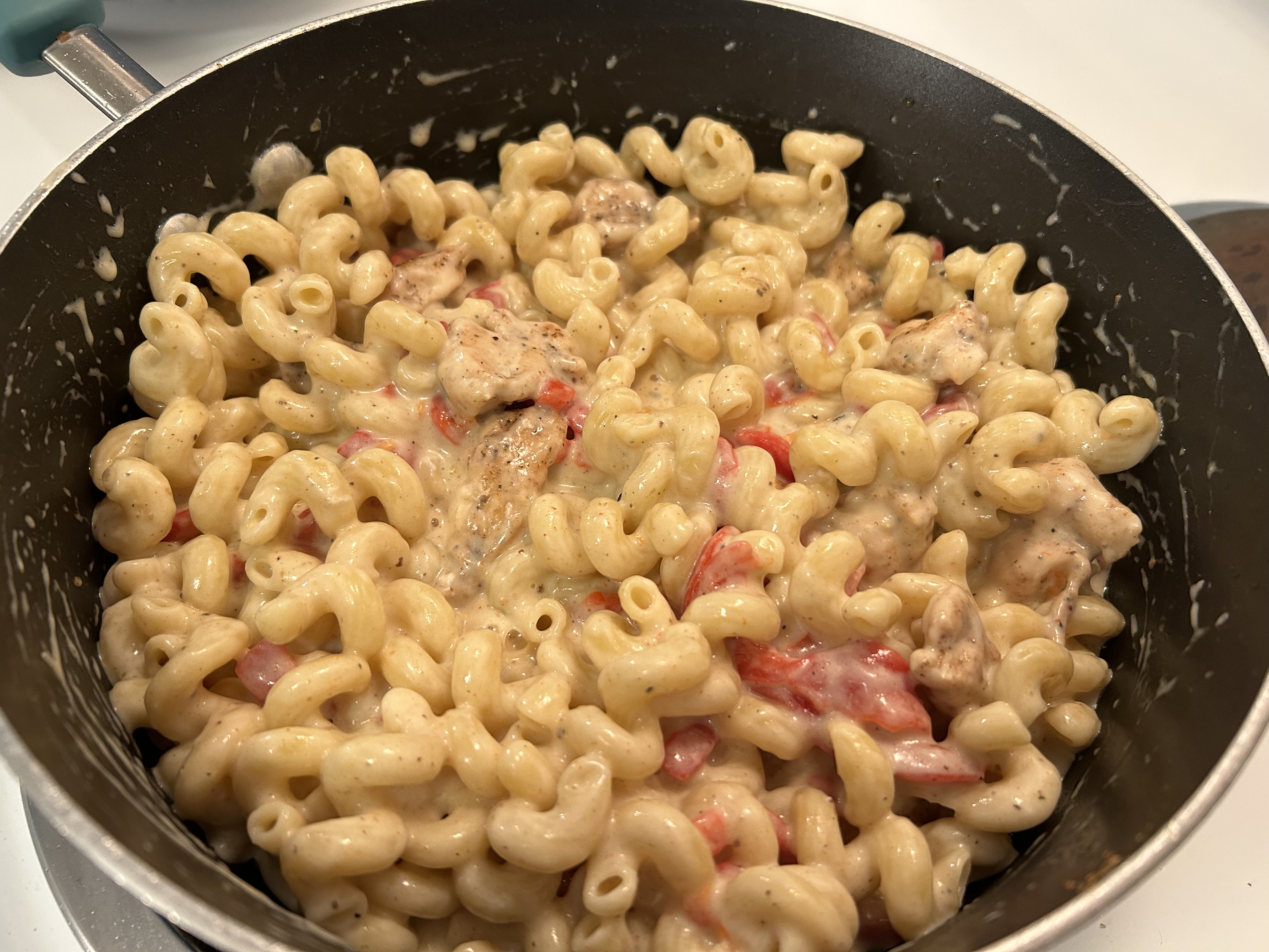 A photo of pasta with peppers and chicken, taken with the iPhone 14.